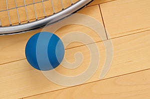 Blue Rubber Racquetball and Racquet photo