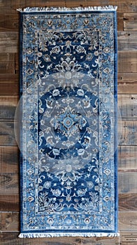 A blue rug on a wooden floor with an ornate design, AI