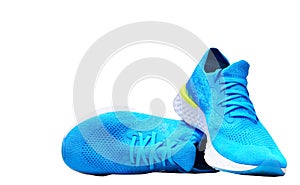 Blue runnung or sport shoes on isolated white background photo