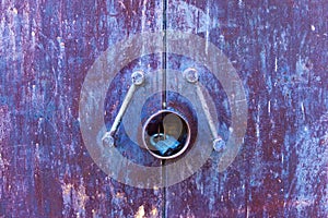 Blue rusty metal texture door with lock.