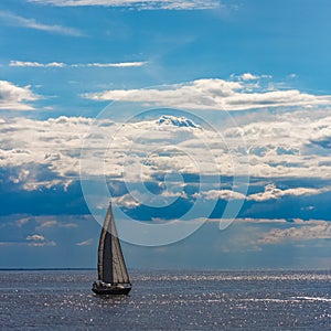 Blue sailboat at journey