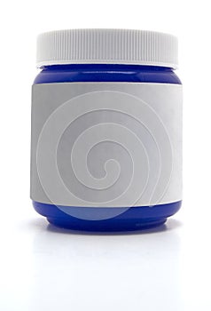 Blue salve medicine container with white label