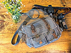Blue Satchel With Camera and Some Equipment