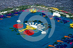 Blue sawdust alfombra for Semana Santa on cobbled street, Antigua, Guatemala photo