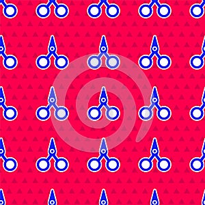 Blue Scissors icon isolated seamless pattern on red background. Cutting tool sign. Vector Illustration