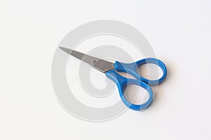 Blue scissors isolated on a white background.