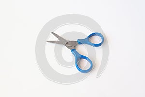 Blue scissors isolated on a white background.