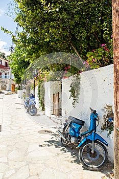 A blue scooter parked at home. Photograph taken at Lefkada Island, Greece-2