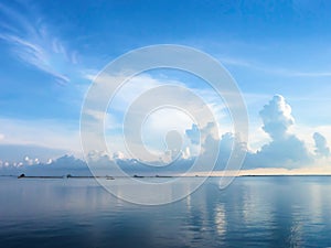 Blue sea and blue sky background with cloudscape