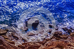 Blue sea and brown stone beach landscape summer background photo