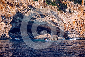 Blue sea and the characteristic caves of Cala Luna, a beach in the Golfo di Orosei, Sardinia, Italy. Big sea caves in the