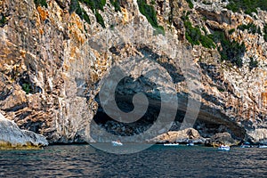 Blue sea and the characteristic caves of Cala Luna, a beach in the Golfo di Orosei, Sardinia, Italy. Big sea caves in the