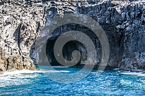 Blue sea and characteristic caves of Cala Luna Golfo di Orosei Sardegna or Sardinia Italy