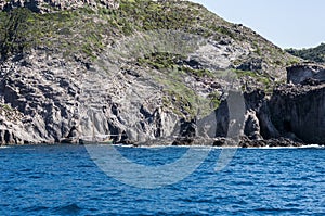 Blue sea and characteristic caves of Cala Luna Golfo di Orosei Sardegna or Sardinia Italy