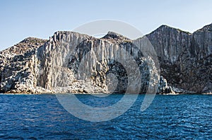 Blue sea and characteristic caves of Cala Luna Golfo di Orosei Sardegna or Sardinia Italy