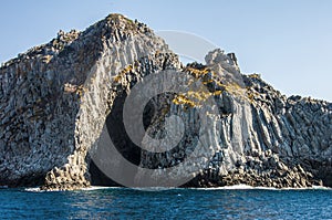 Blue sea and characteristic caves of Cala Luna Golfo di Orosei Sardegna or Sardinia Italy