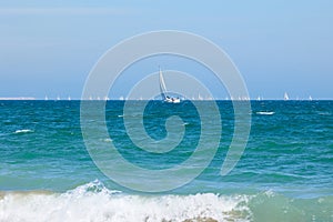 Blue Sea, clear skies and a lot of sailboats photo