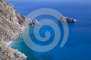 Blue sea and cliff of greek island