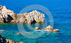 Blue sea in Costa Paradiso rocky shore