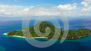 Blue sea with islands, aerial view. Seascape with a tropical island, Philippines.