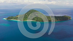 Blue sea with islands, aerial view. Seascape with a tropical island, Philippines.