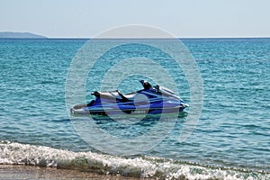 Blue sea and a jet ski floating on Aegean sea.