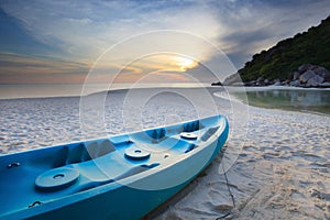 Blue sea kayak on the beach