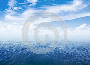 Blue sea or ocean water surface with horizon and sky