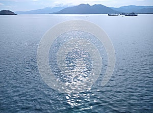 The Blue Sea in Poto Tano Harbour photo