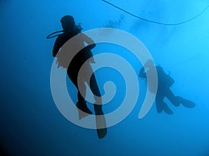 blue sea scuba divers silhouttes philippines