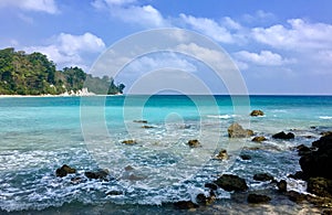 Blue sea water and stone in nature with blue sky