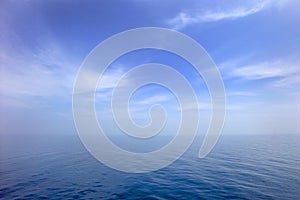 Blue sea or water surface with horizon and sky