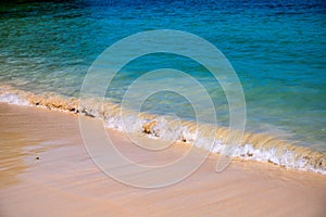 Blue sea water and white beach on sunny day. Tropical island paradise photo. Clear seawater tide on smooth sand