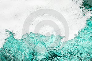 Blue sea water white foam texture background closeup, foamy ocean wave pattern, aqua bubbles surface, swimming pool backdrop