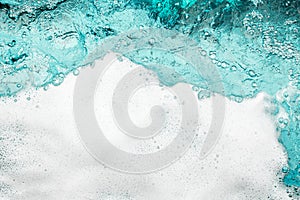 Blue sea water white foam texture background closeup, foamy ocean wave pattern, aqua bubbles surface, swimming pool backdrop