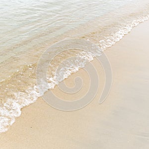 Blue sea wave background on sandy beach
