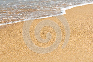 Blue sea wave on sandy beach. Travel background. Soft focus