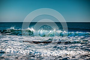 Blue sea with waves and clear blue sky