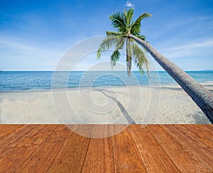 Blue sea, white sand, coconut palm tree and blue sky with wooden bridge walkway in Summer background. Summer beach fresh concept.