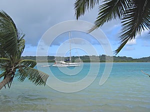 Blue sea with a yatch photo