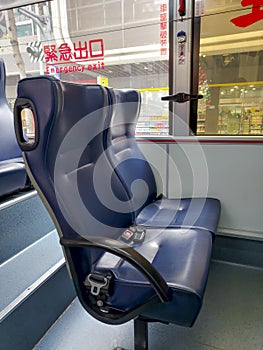 Blue seats inside a bus.