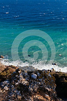 Blue Seawater with sea foam as background