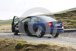 Blue sedan car from back, open door