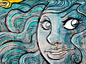 Blue Seducting Siren's Face Grafito on Public Wall, Street Art G photo