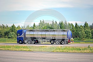 Blue Semi Tank Truck on Freeway at Summer