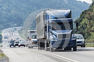 Blue Semi-Truck With Other Traffic On Interstate Highway