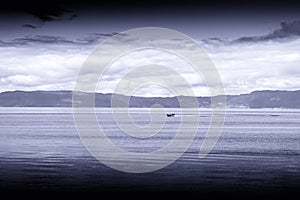 Blue sepia boat in Norway sea landscape background