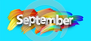 Blue september paper banner with colorful brush strokes.