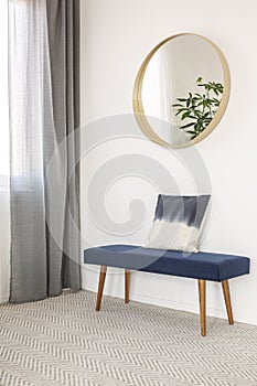 Blue settee with pillow in elegant waiting room