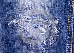 Blue sewn jeans close-up. reuse of things